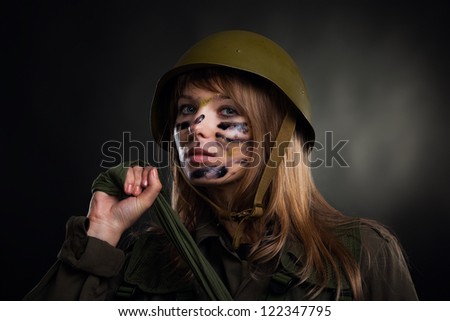 army girl, soldier woman wear helmet military uniform over black background