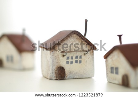 Small houses made of wood, furniture, chairs and desks