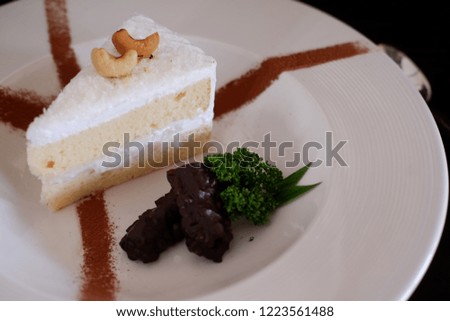 coconut cream cake on wood table