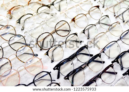 Glasses, Eyeglasses Optical Store, Fashion eyewear at night market, Colorful glasses, Glasses on shelf, Glasses in optical store shopping mall (Selective Focus) Royalty-Free Stock Photo #1223575933