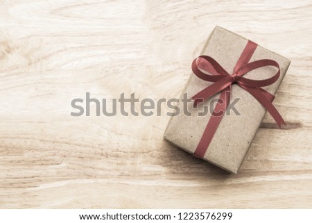 Gifts for special moments flat lay with copy space on wooden background