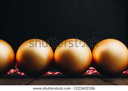 Christmas decorations in gold on wooden background in black. New 2019 year. close-up, macro photo. Christmas, holiday, the year of the pig