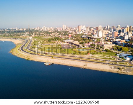 Aerial panoramic view of skyscrapers skyline of Latin American capital of Asuncion city, Paraguay on a sunny day. Embankment of Paraguay river. Ciudad de Asunción Paraguay. South America.