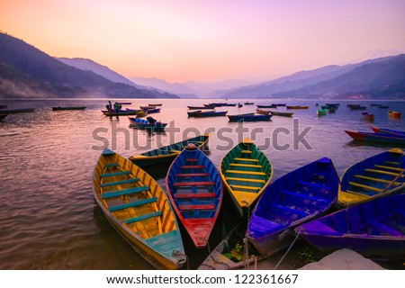 twilight with boats on Phewa lake, Pokhara, Nepal Royalty-Free Stock Photo #122361667