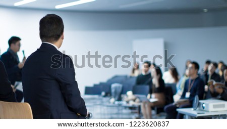 Panel Speaker on Stage Presenting Vision and Ideas. Conference Lecture Hall. Blurred De-focused Unidentifiable Presenter and Audience. People Attendees. Business Technology Event. Debate Discussion.
 Royalty-Free Stock Photo #1223620837