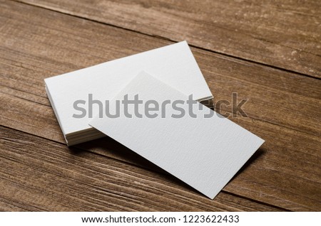 white blank business card on a wooden background