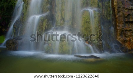 The waterfall with green water / HDR picture