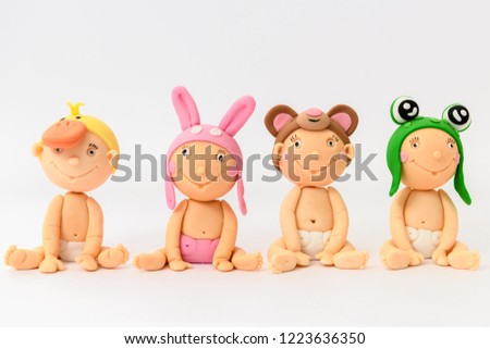 cute homemade sugarpaste babies with animal hats
