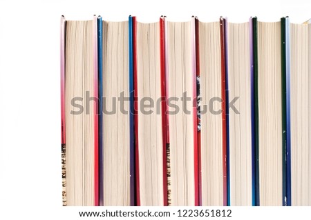 Books in a row on white background.