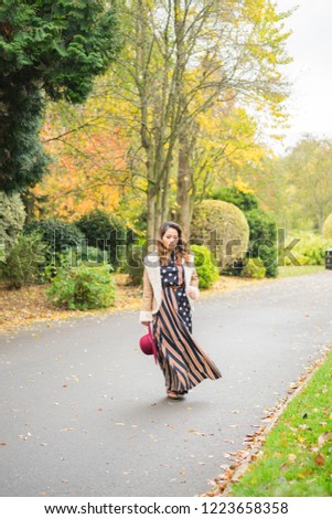 Filipino female model in a park at Autumn time