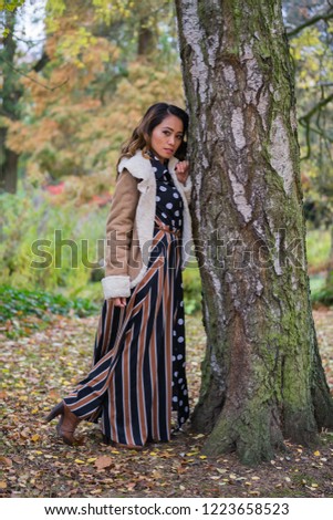 Filipino female model in a park at Autumn time
