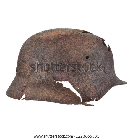 Authentic German Second World War helmet with bullet hole isolated on a white background