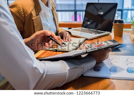 Administrator business man financial inspector and secretary making report calculating balance. Internal Revenue Service checking document. Audit concept