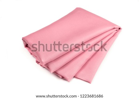 Pink fabric folded isolated on white background.