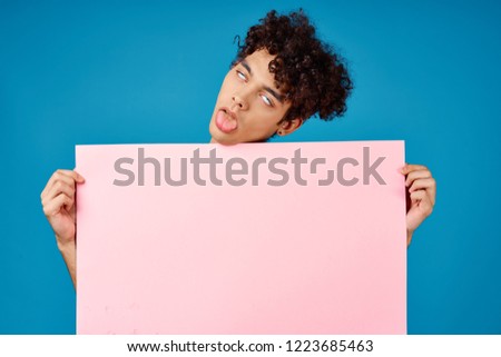 man grimaces see in front of him pink mockup                