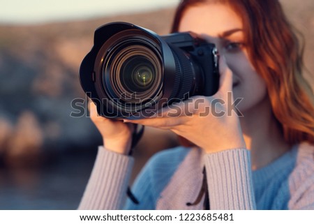 woman with a camera in nature                     