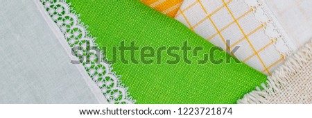 Cloth tablecloth and napkins as Easter background. Set of traditional  Easter fabric household linen and napkin , banner