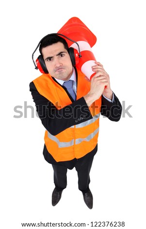 Man with traffic cone