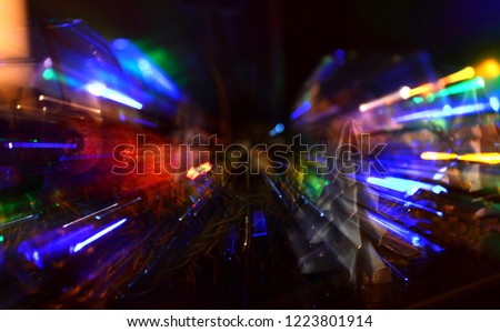 Abstract image of of the Christmas light with long exposure and zoom effect