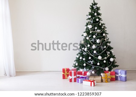 Green Christmas tree with toys new year winter gifts decor