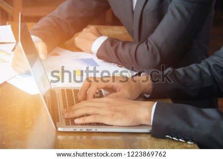 Close up of male hands typing on keyboard, man working at office and using Notebook.Soft focus.