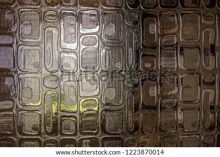 The window light is visible through the decorative door glass. Close up photography.