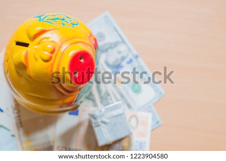 
New Year 2019 and piggy bank for money. Concept of cash growth. Save money for presents at Christmas and New Year.