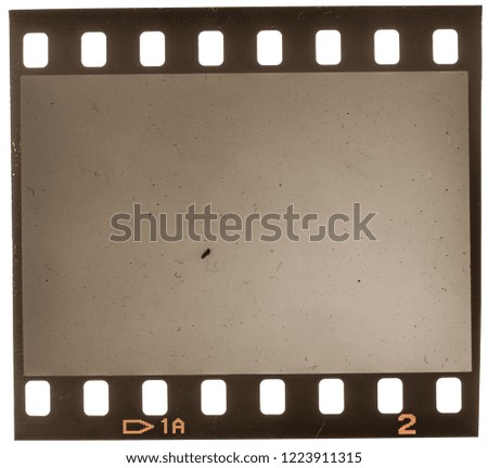 old and grungy 35mm dia filmstrip on white, real macro photo