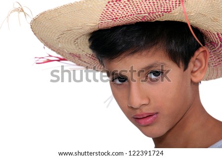 Portrait of boy with big hat
