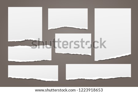 White note, notebook paper strips with torn edges stuck on dark brown background. Vector illustration. Royalty-Free Stock Photo #1223918653