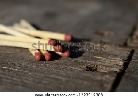 Matches laying on a table.