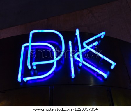 Blue neon letters.