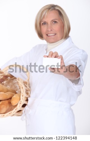 Female bakery worker displaying card