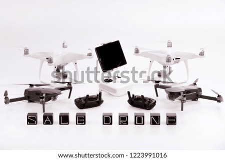Flying drones lie on a white background. Theme selling and buying drone.
