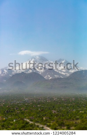 Big snowy mountain, foggy village. Excellent landscape. Perfect nature. Erciyes Mountain, Kayseri, Turkey.