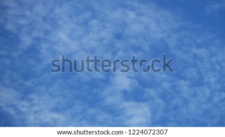 Fluffy clouds in blue sky