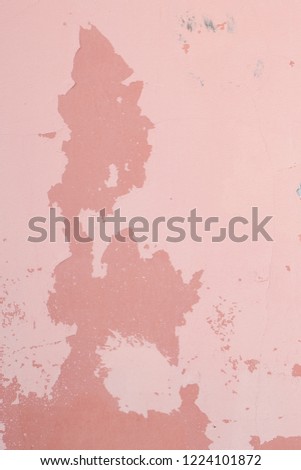 background pink wall with peeling paint, dark spots. Photo format vertical