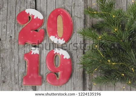 Christmas of New Year 2019 Card Concept. Ginger biscuits of the form of numbers 2019 on stone concrete gray background. Top view. Flat Lay.
