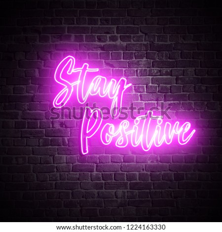 Stay Positive Pink Neon sign on dark brick wall