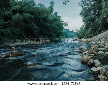 nature seasonal background winter river rapids at thailand.