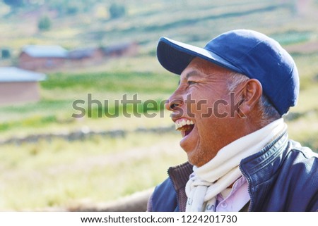 Native american man laughing in the countryside.