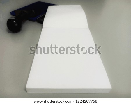 Note pads are placed on the table.