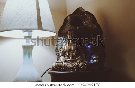 Buddha statue and lamp. 