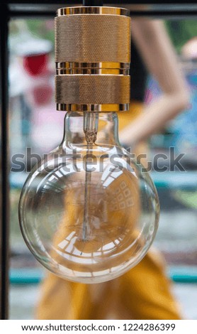Light bulb in the coffee shop near window