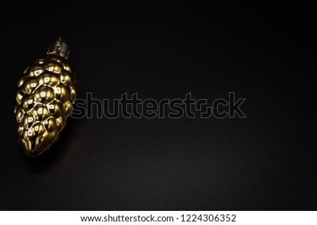Wallpaper background of gold Christmas decoration object isolated on black background.