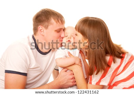 Happy family. Parents kissing the kid. Isolated on white background.