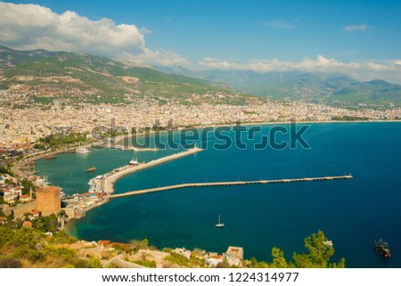 Top view of the city: the blue sea, mountains, lighthouse, walls and port. Alanya, Antalya district, Turkey, Asia