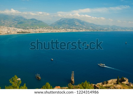 Beautiful landscape top view of the city: the blue sea, mountains and ships. Alanya, Antalya district, Turkey, Asia