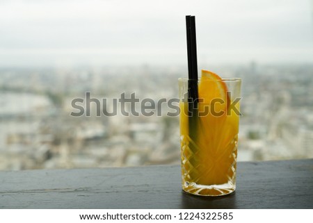                              Orange Juice in front of London Skyline  