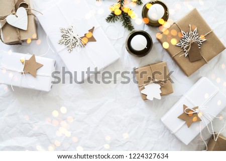 Christmas handmade gift boxes on white crumpled background top view. Merry Christmas greeting card, frame. Winter xmas holiday theme. Happy New Year. Noel. Flat lay